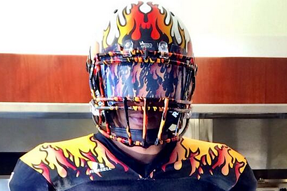 KISS Reveal Insane Flaming Helmets + Uniforms for AFL Team